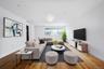 Living room with wood finished floors and baseboards