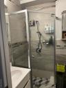 Bathroom with a shower stall and vanity