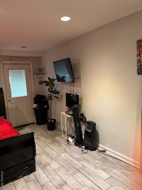 Living room featuring light wood-type flooring and recessed lighting