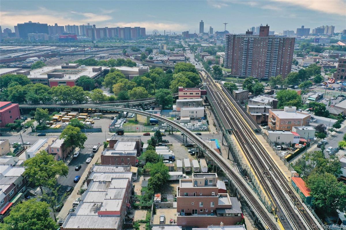 View of property location with nearby urban area