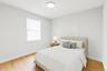 Bedroom with baseboards and light wood-type flooring