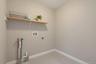 Washroom with washer hookup and hookup for an electric dryer
