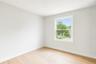 Spare room with baseboards and light wood finished floors
