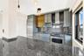 Kitchen with wall chimney range hood, stainless steel appliances, tasteful backsplash, and dark stone countertops
