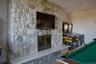 Recreation room with billiards table and a fireplace
