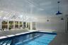 Indoor pool featuring a skylight