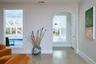 Sitting room featuring finished concrete floors and baseboards