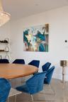Dining space with finished concrete flooring and baseboards