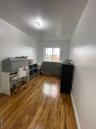 Office space with wood finished floors and baseboards