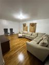 Living area with hardwood / wood-style floors