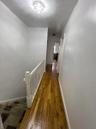 Corridor featuring hardwood / wood-style floors and an upstairs landing