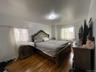 Bedroom with wood finished floors
