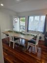 Dining space with dark wood-type flooring and recessed lighting