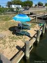 View of swimming pool featuring a dock