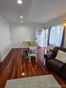 Dining room with dark wood finished floors and recessed lighting