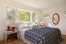 Bedroom with multiple windows