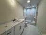 Bathroom featuring vanity, shower / bath combination, light tile patterned flooring, and recessed lighting