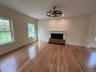 Unfurnished living room with natural sunlight, a fireplace, light wood finished floors, recessed lighting, and a ceiling fan