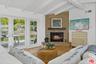Living room w/ fireplace off o