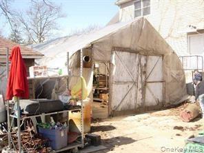 View of outdoor structure featuring an outbuilding