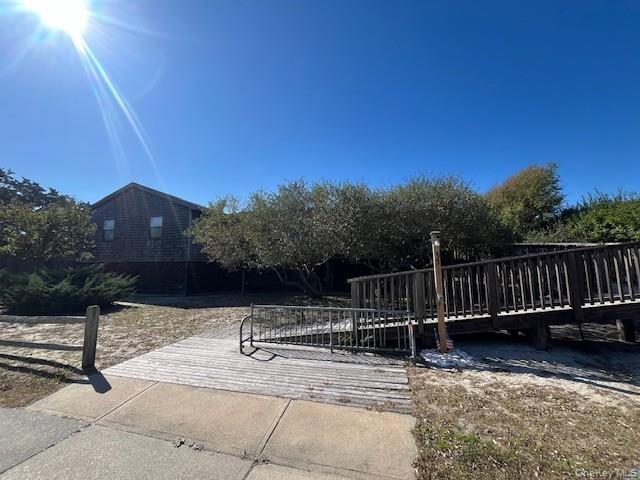 View of property's community featuring a wooden deck