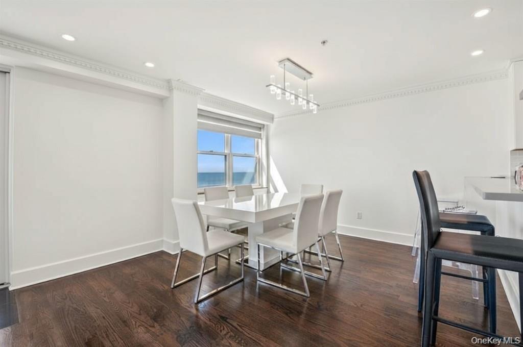Dining room featuring recessed lighting and dark wood-style flooring