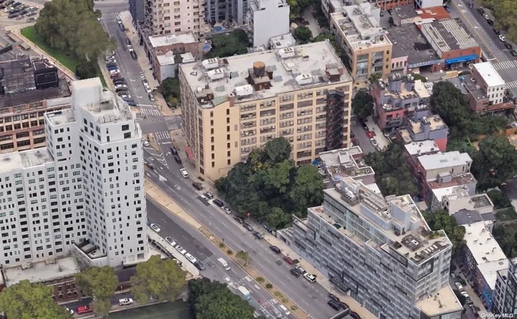 Aerial view of property's location with nearby urban area