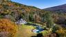 Fall aerial view of property and pool