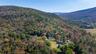 Aerial view of property's location featuring mountains