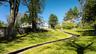 Stone path/staircase leading from pool house to main residence