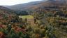 Aerial view of property and surrounding area with mountains
