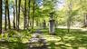Wooded pathway, With giant urns, leading to a second Pagan Maze