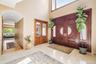 Foyer featuring arched walkways and high vaulted ceiling