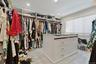 Spacious closet with light wood finished floors