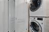 Washroom with estacked washer and dryer