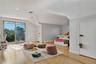 Bedroom featuring light wood finished floors and vaulted ceiling