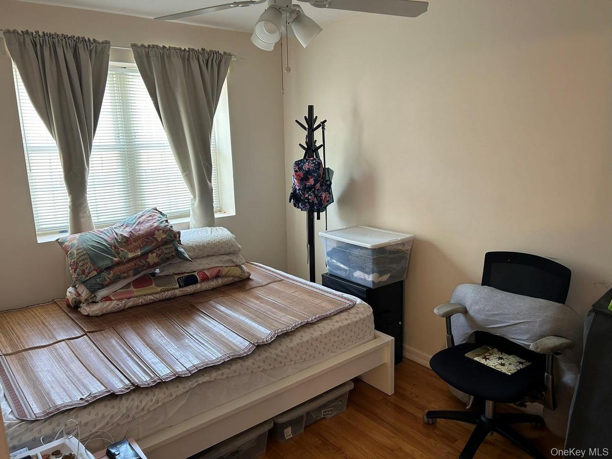 Bedroom with wood finished floors and ceiling fan