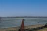 Dock with view of water and beach