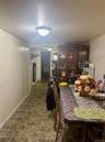 Dining space with a textured ceiling and baseboards