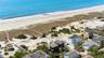 Aerial view with a water view and a view of the beach