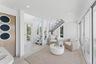 Sitting room featuring baseboards, recessed lighting, stairway, and a healthy amount of sunlight
