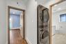 Laundry area featuring recessed lighting and stacked washer / drying machine