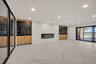 Unfurnished living room featuring light marble finish floors and recessed lighting