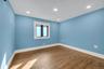 Spare room with wood finished floors and recessed lighting