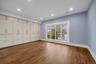 Unfurnished bedroom with light wood-type flooring, recessed lighting, and a closet