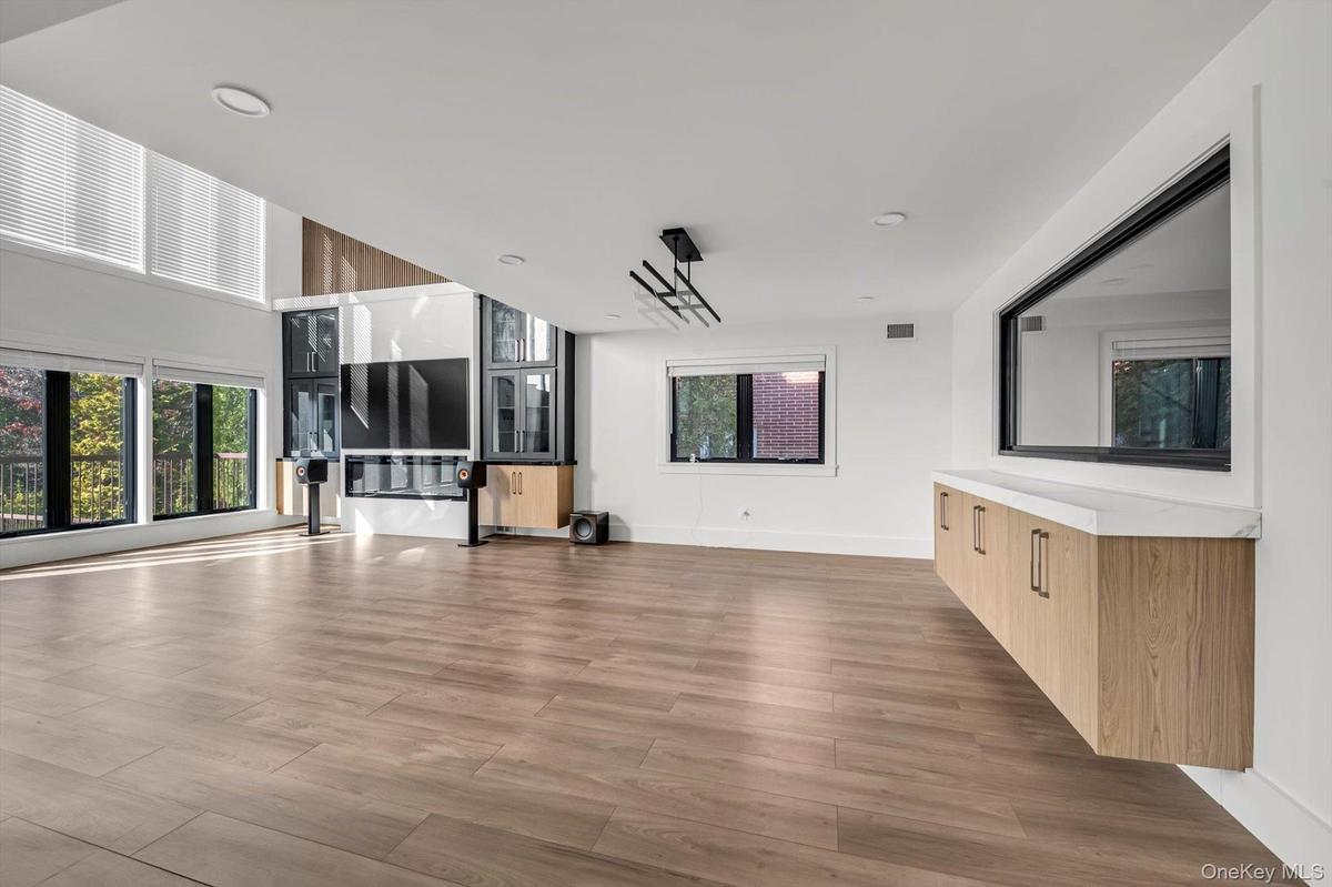 Unfurnished living room with plenty of natural light and light wood-style floors