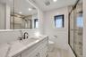 Bathroom with vanity, recessed lighting, and shower / bath combination with glass door