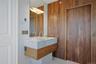 Primary bathroom custom Dolce Vita marble sink and walnut custom closet