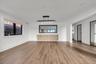 Unfurnished living room featuring light wood-type flooring and recessed lighting