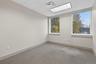 Spare room with carpet and a paneled ceiling